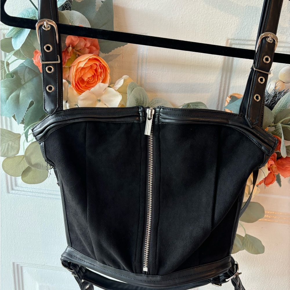 Maniere De Voir Black Leather Bag with Silver Zipper and Structured Design